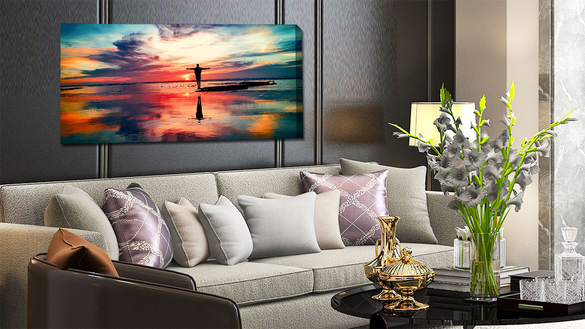 Panoramic canvas print of a sunset hanging over a settee
