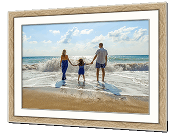Picture of a family day on the beach in a wooden frame