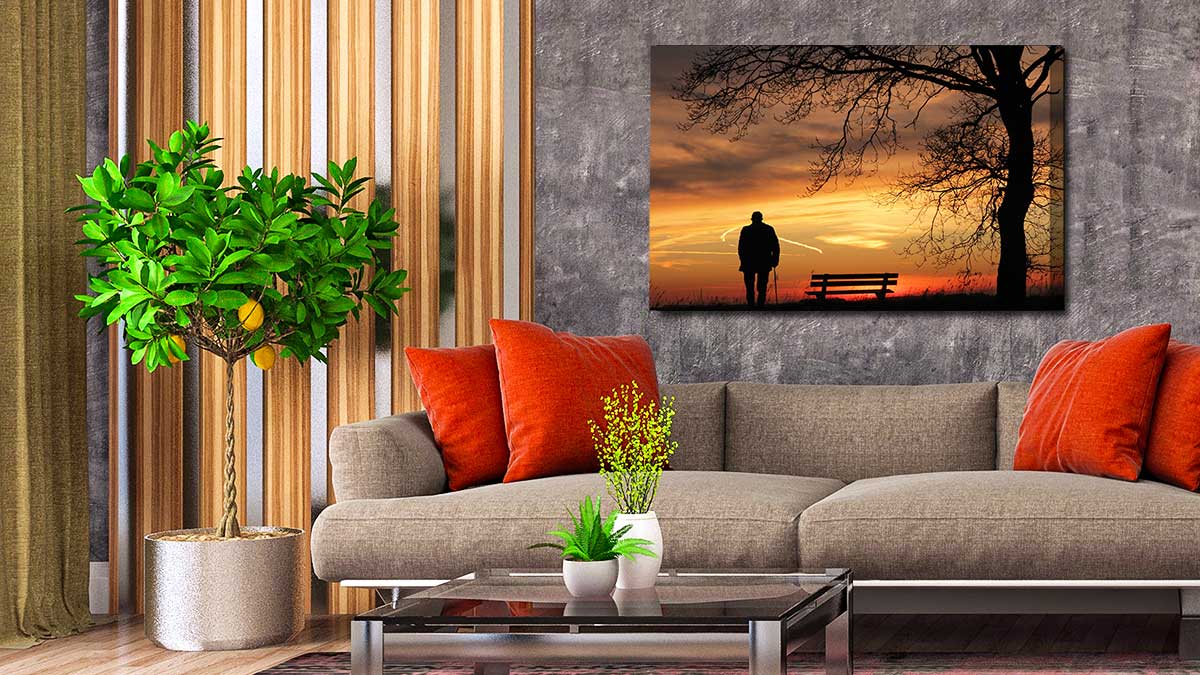 Canvas print of an elderly gentleman standing in the sunset, hung in a classically styled sitting room
