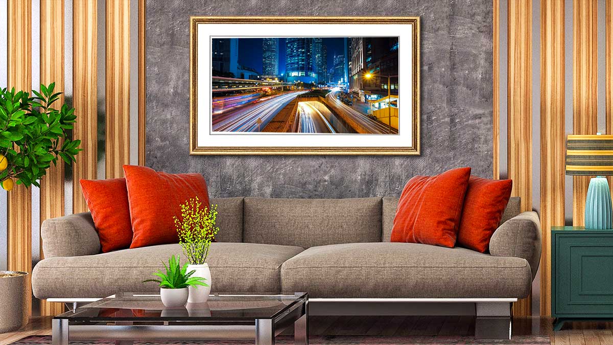 Sweeping cityscapes poster in a frame and hung over a settee