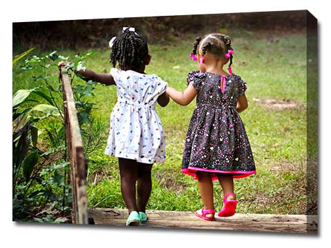 Canvas print featuring two girls walking in a garden