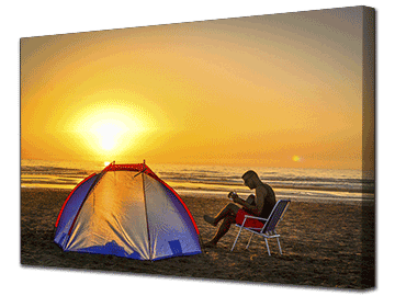 Picture of a man playing a guitar on a beach