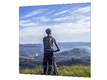 Square print of a picture showing a young male cycling