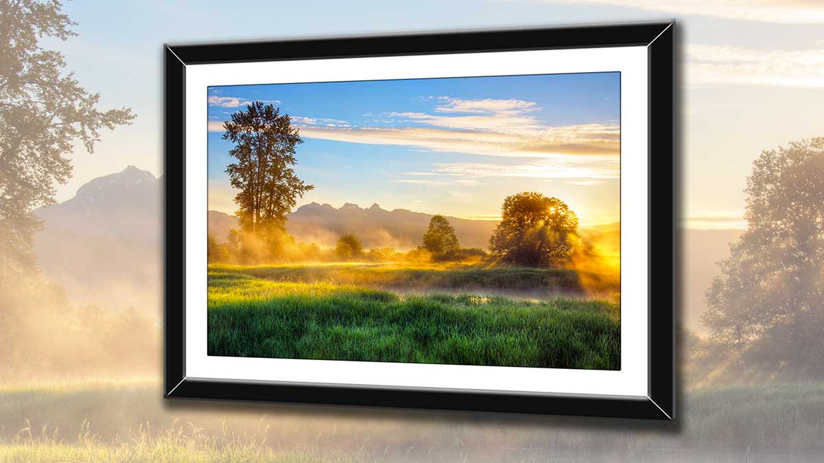 Picture of a misty sunrise in a simple black frame