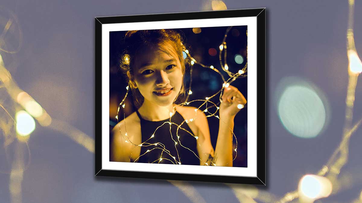 Framed picture girl with fairy lights