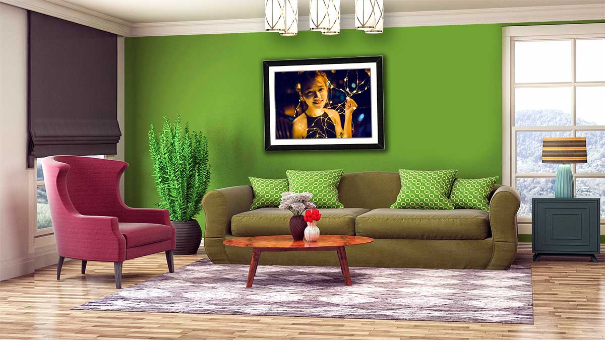 Green room with a photo of a girl framed in black